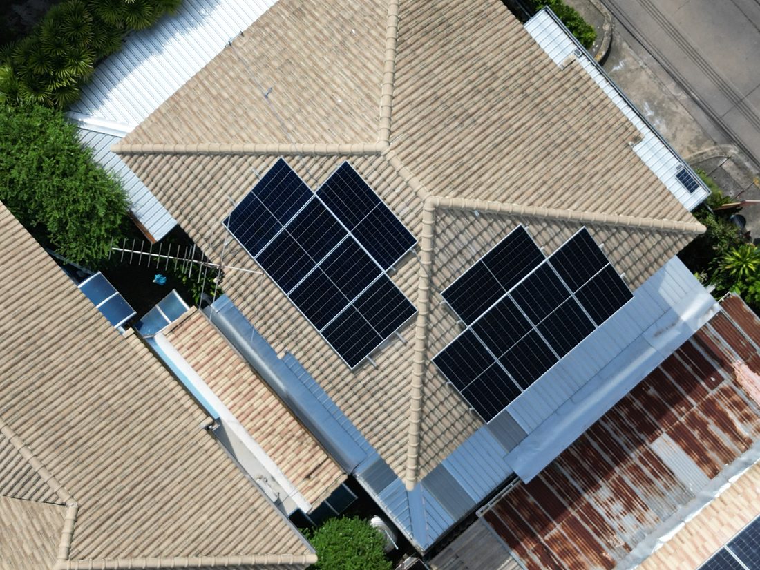 Close drone view of the panels on the tiled roof