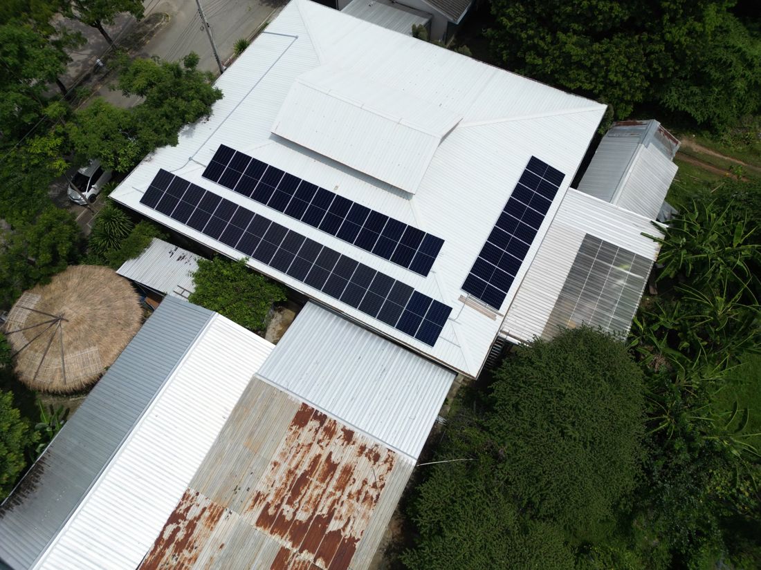The array from above: three rows on a metal-sheet roof