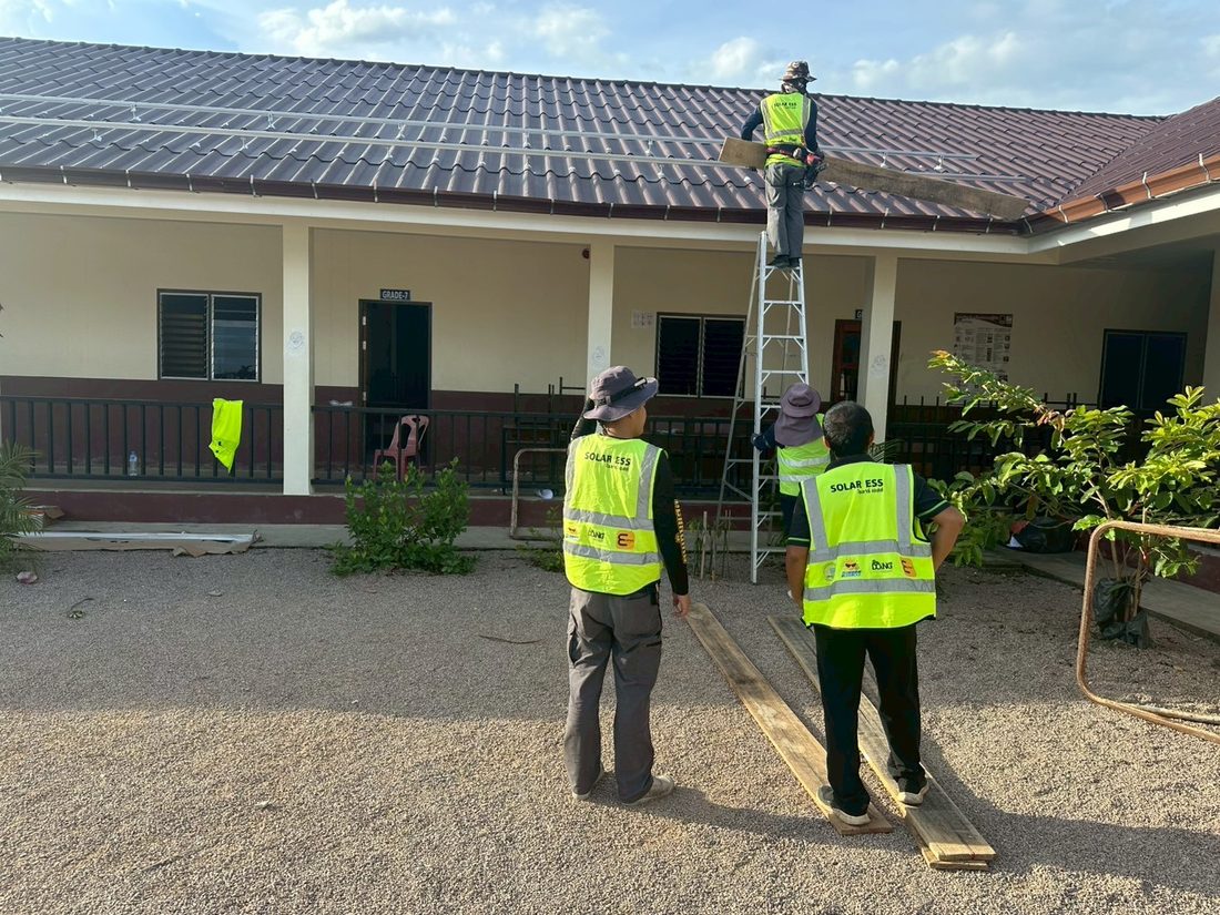 Our team at work on the tiled roof