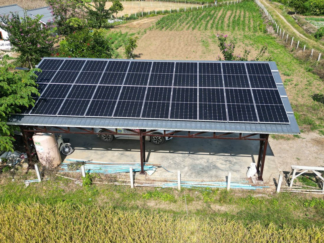 Array on a raised shed roof among the fields