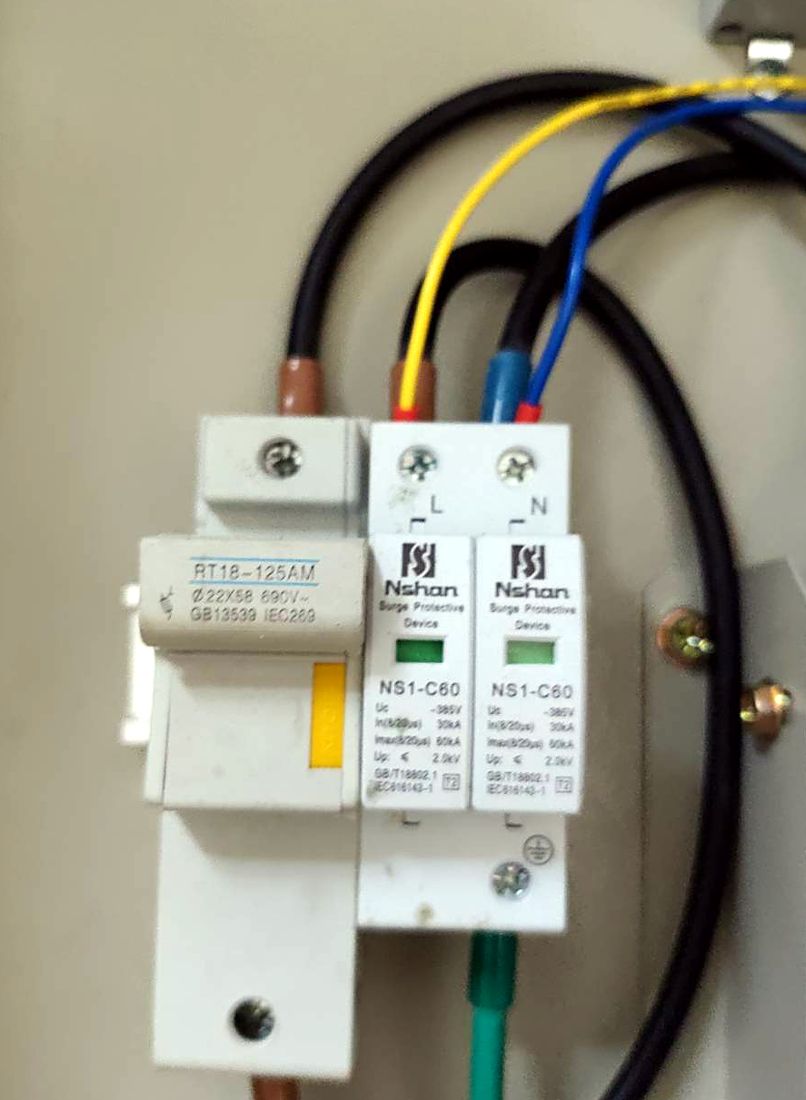 Surge protection device and fuse holder wired to the main breaker